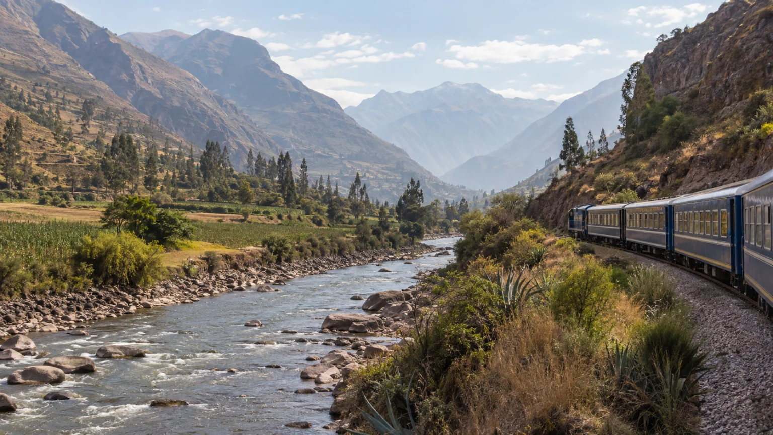 Passenger train traveling beside the Urubamba River through Peru’s Sacred Valley.